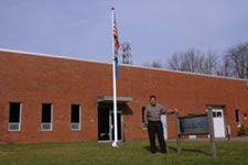 photo of lee stanford infront of leland building