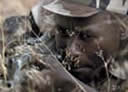 photo of man aiming rifle